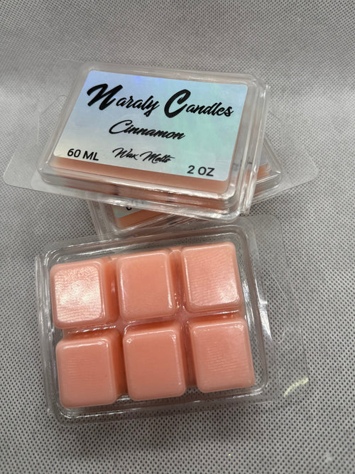 Two containers of wax melts with a label on a gray background